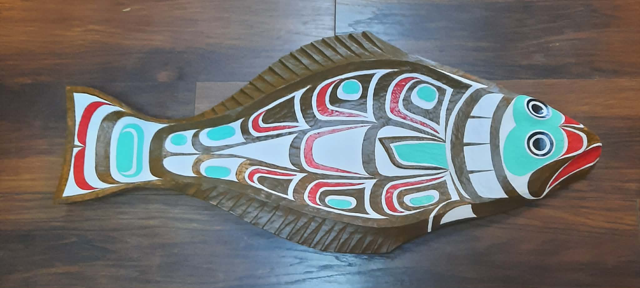 Carved and painted halibut plaque